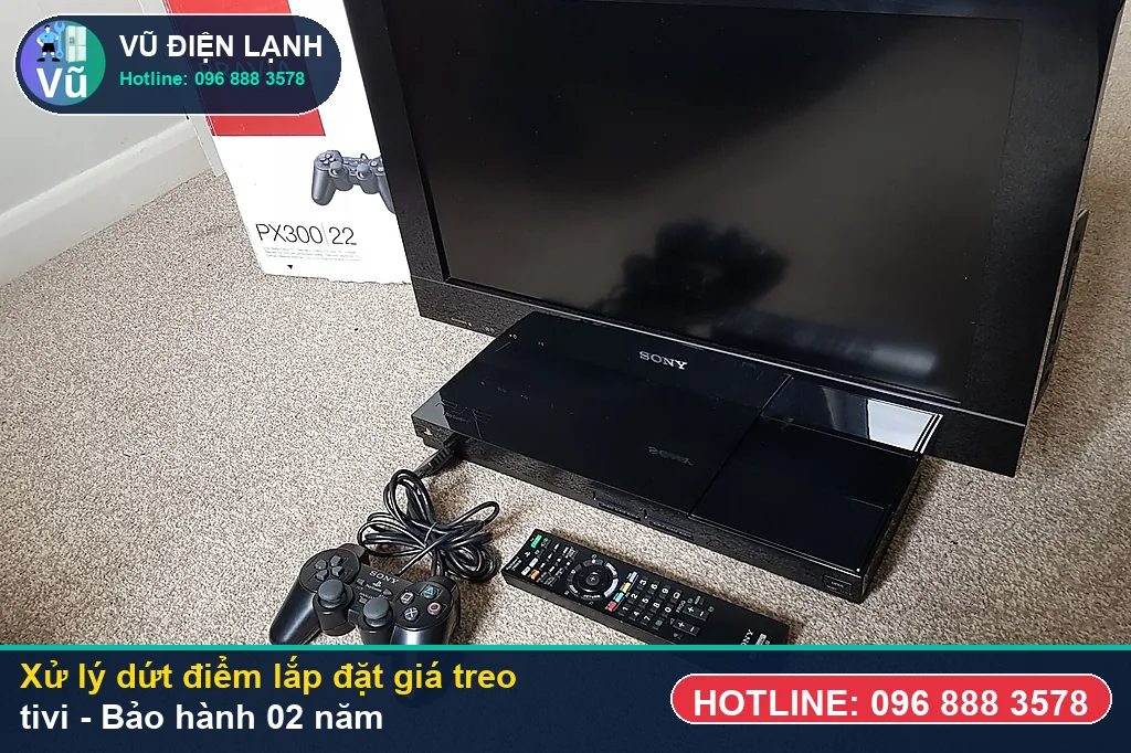 Hoàn tất xử lý lắp đặt giá treo tivi, kiểm tra hình ảnh 4K sắc nét và bàn giao phiếu bảo hành 02 năm Vũ Điện Lạnh